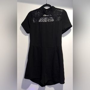 Black backless ROMPER! Super cute! Never been worn and all tags still attached!